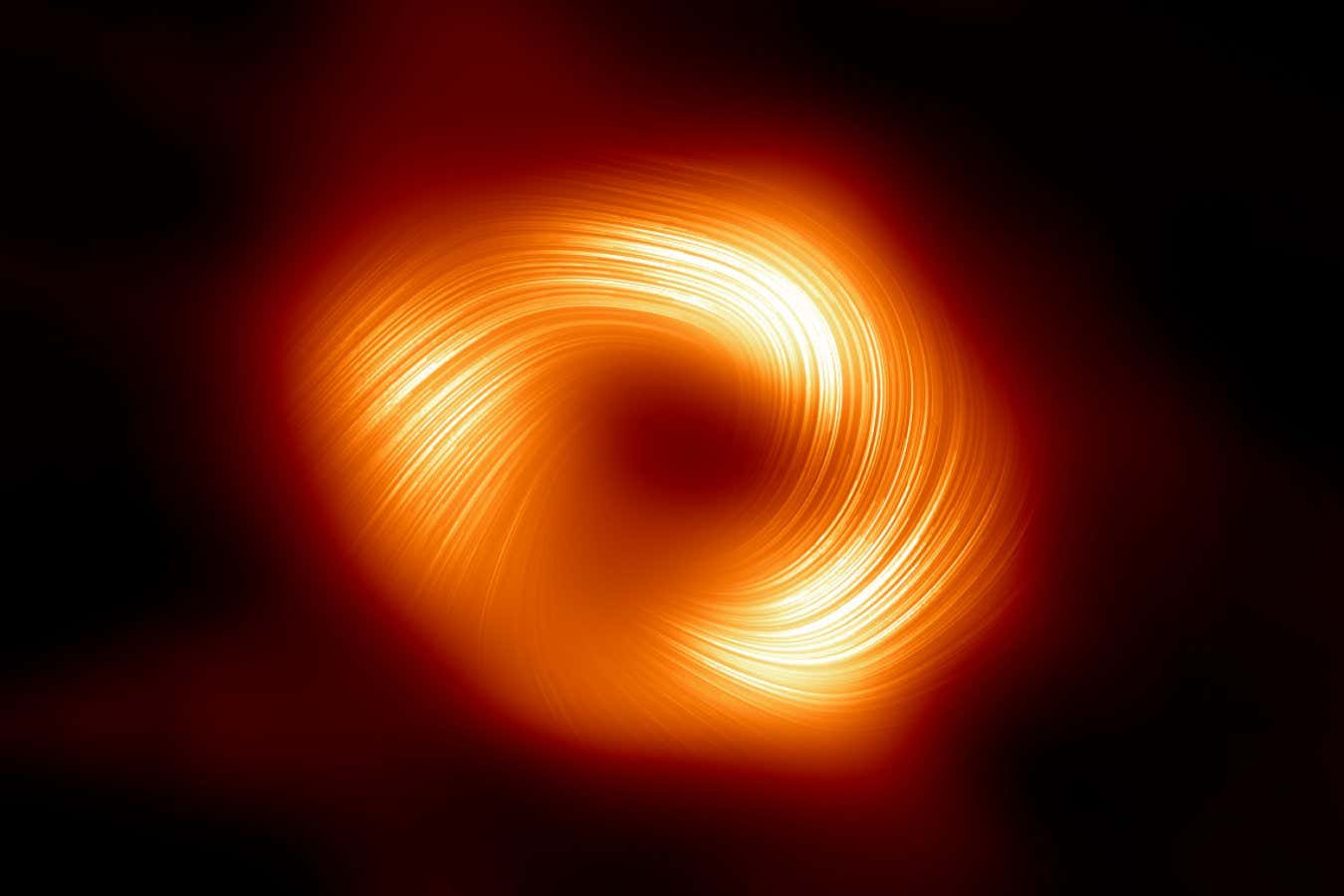 Nueva vista del agujero negro de nuestra galaxia revela un campo magnético giratorio