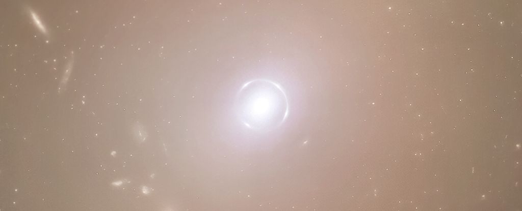 Astrónomos asombrados por el perfecto ‘Einstein Ring’ brillando en el espacio: Sciencealert